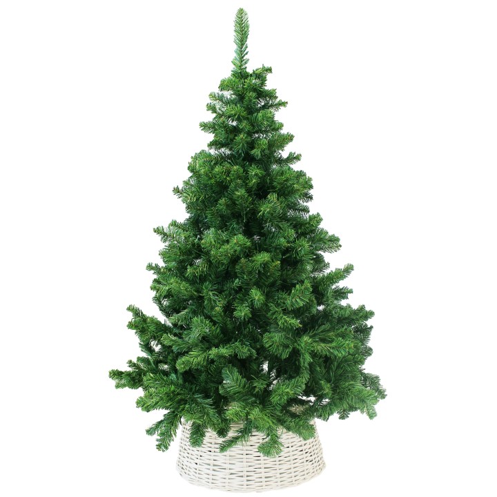 A lush green artificial Christmas tree in a white woven basket.
