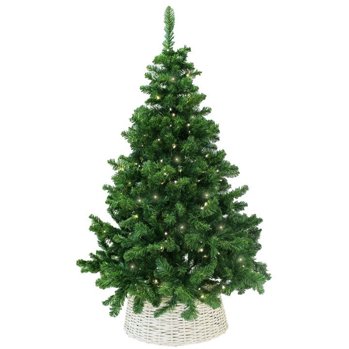 A lush green artificial Christmas tree adorned with warm white lights in a woven basket.