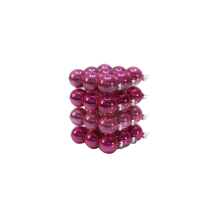 A vibrant stack of shiny magenta ornaments arranged in a neat, layered formation.