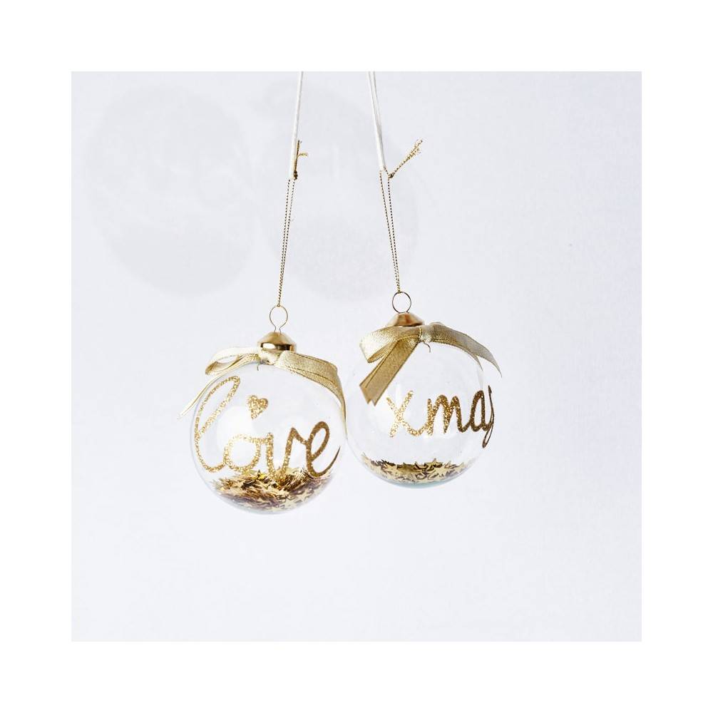 Boule en verre transparente, écriture dorée et paillettes Boule en verre transparente, écriture dorée et paillettes