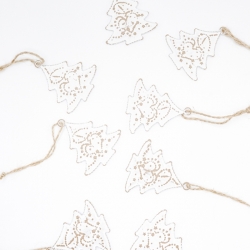 Delicate white paper Christmas trees adorned with golden outlines, strung on twine.