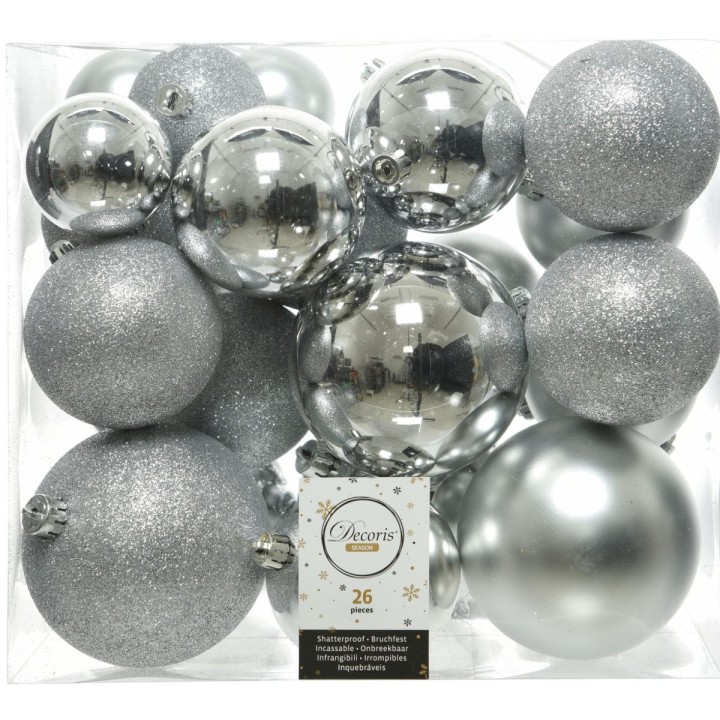 A collection of shiny silver and glittery ornaments in various sizes and shapes.
