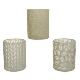 Three decorative glass candle holders with intricate cut-out patterns and a soft, neutral color.