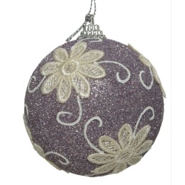 A glittery lavender ornament adorned with delicate white floral patterns.