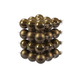 A stack of shiny, bronze-colored Christmas ornaments reflecting light.