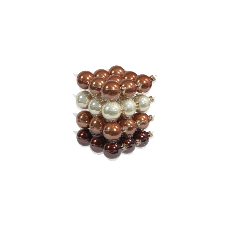 A stacked arrangement of shiny, decorative baubles in bronze, gold, and cream tones.
