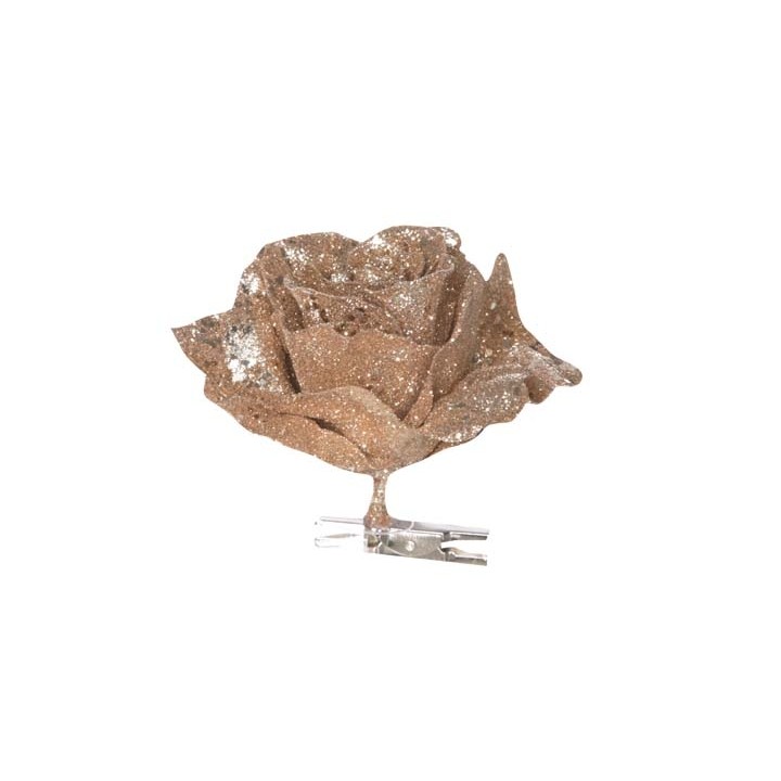 A sparkling brown rose made of textured material, attached to a clear clip.