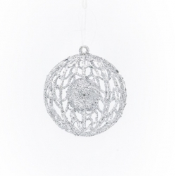 A delicate, shimmering silver ornament with intricate lace-like patterns.