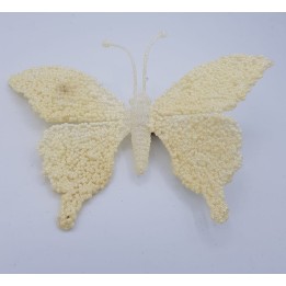 A delicate white butterfly crafted from textured materials, featuring soft, rounded wings.
