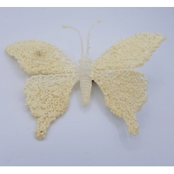 A delicate white butterfly crafted from textured materials, featuring soft, rounded wings.