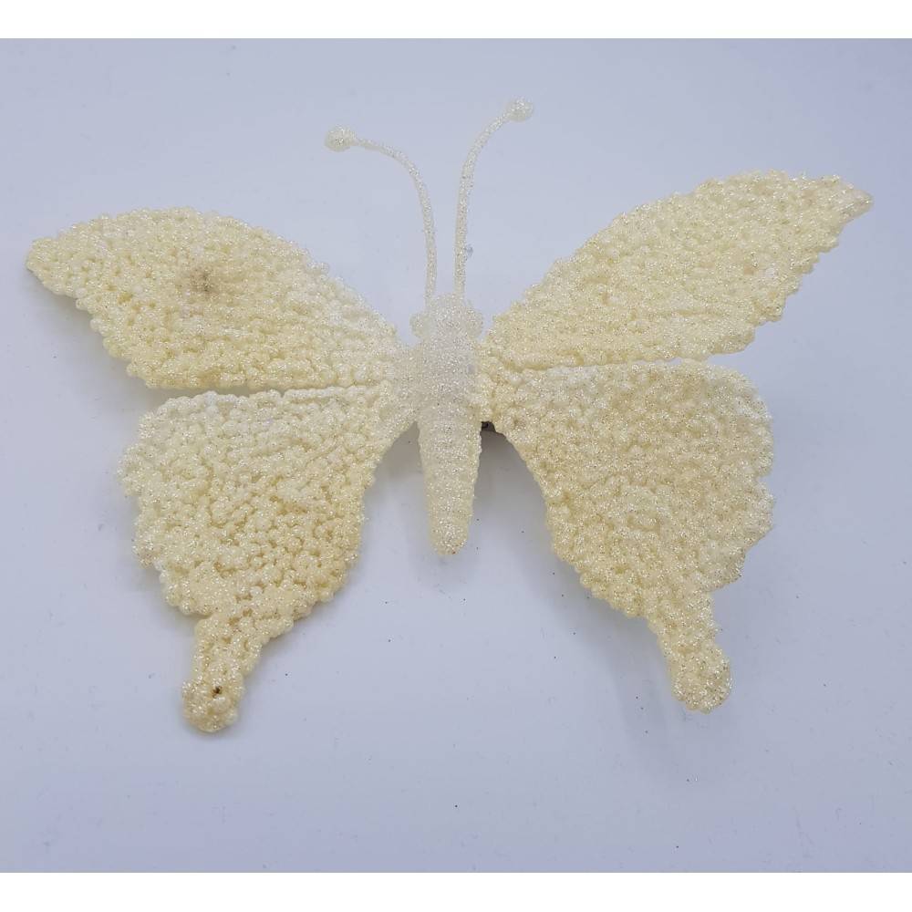 A delicate white butterfly crafted from textured materials, featuring soft, rounded wings.