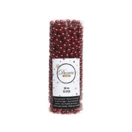 Fil de perles rouges brillantes enroulé dans un tube transparent, décor festif.