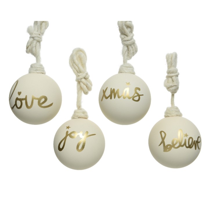 Four white ornaments with gold cursive words: "love," "joy," "xmas," and "believe," hanging by tw...