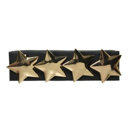 A black hairband adorned with four shiny gold star-shaped embellishments.