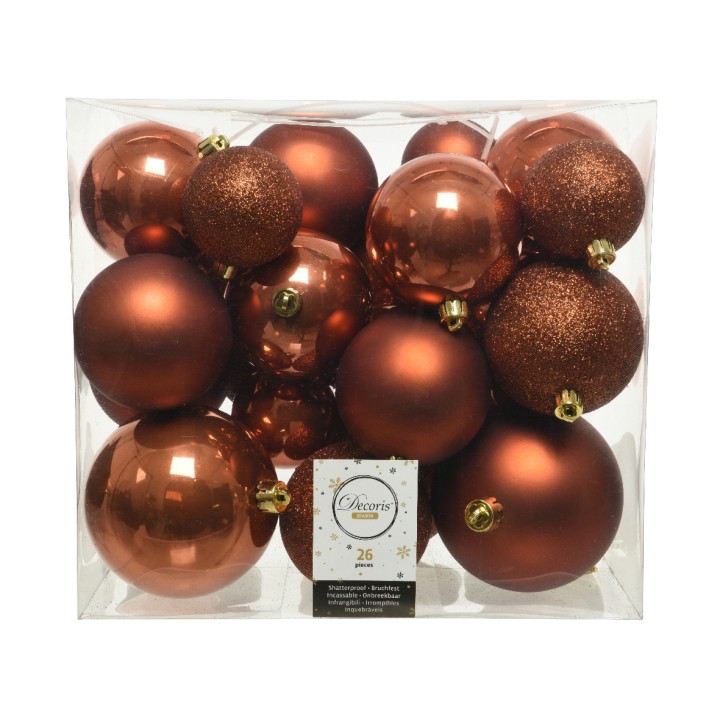 A collection of shiny and matte bronze ornaments in various sizes, arranged in a clear box.