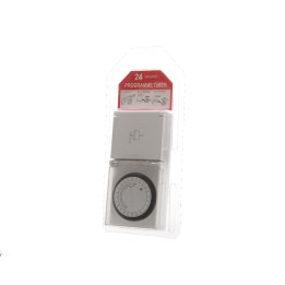A compact, round timer with a silver casing, mounted on a card for easy display.