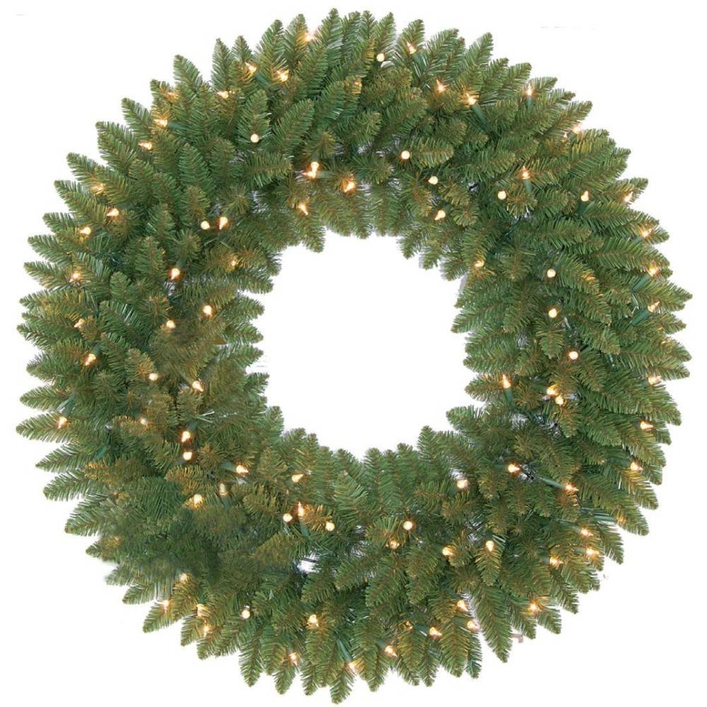 Couronne de Noël en branches vertes, ornée de lumières blanches scintillantes.