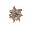 A shimmering gold poinsettia with textured leaves, radiating festive elegance.