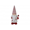 A whimsical gnome in red and white stripes, holding a heart-shaped ornament.