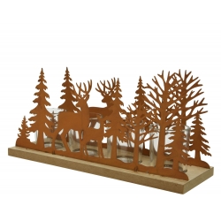 A decorative wooden centerpiece featuring cut-out trees and a deer silhouette.