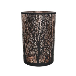 A cylindrical lamp with intricate tree silhouettes casting soft, warm light.