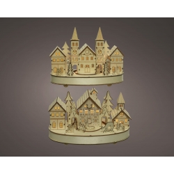 A layered wooden village scene with illuminated houses, trees, and charming architecture.
