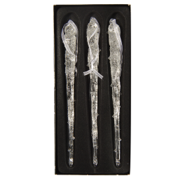 Three elongated, transparent glass icicles with a textured surface, set against a black background.