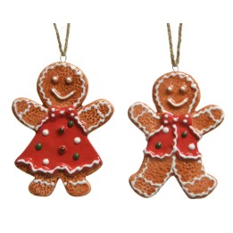 Two cheerful gingerbread figures, one in a red dress and the other in a festive vest, decorated w...
