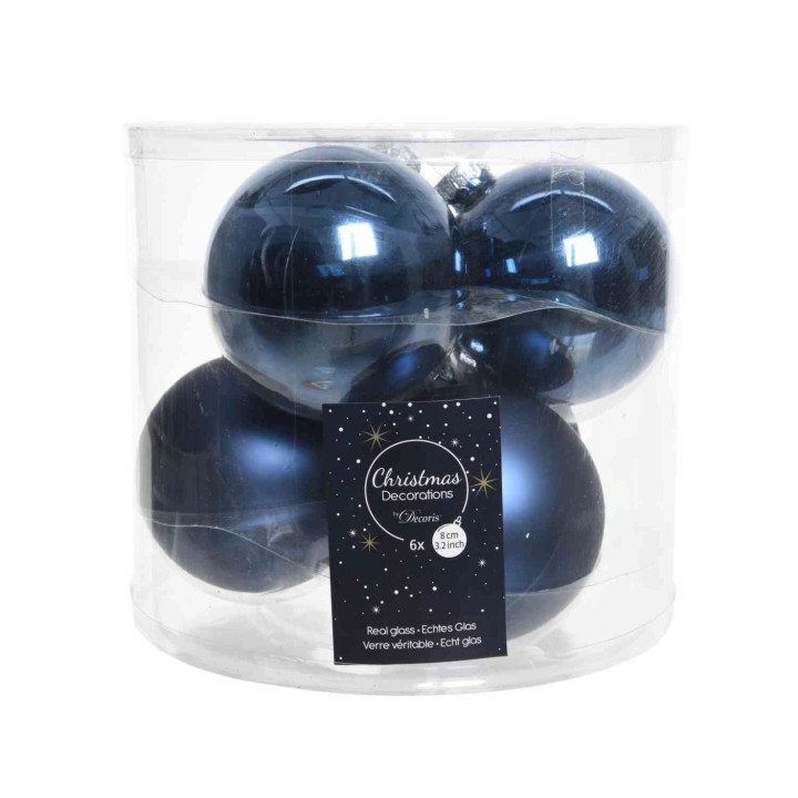 Boules de Noël bleu foncé, brillantes, dans un emballage transparent.