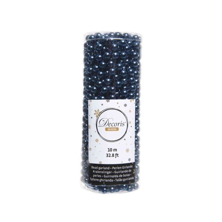 A cylindrical roll of dark blue decorative beads, shiny and reflecting light.