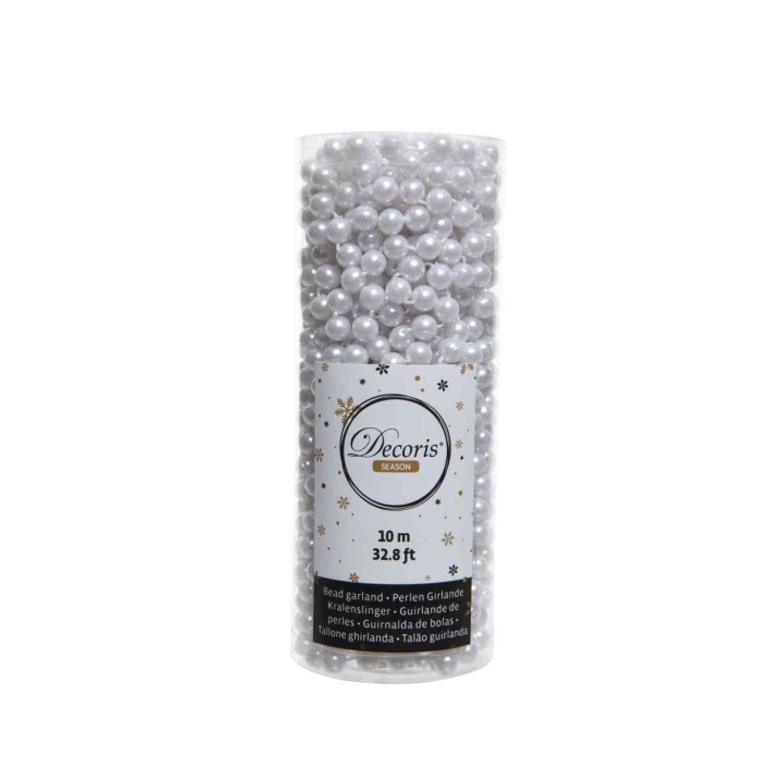 Perles décoratives blanches dans un tube transparent, idéal pour l'artisanat.