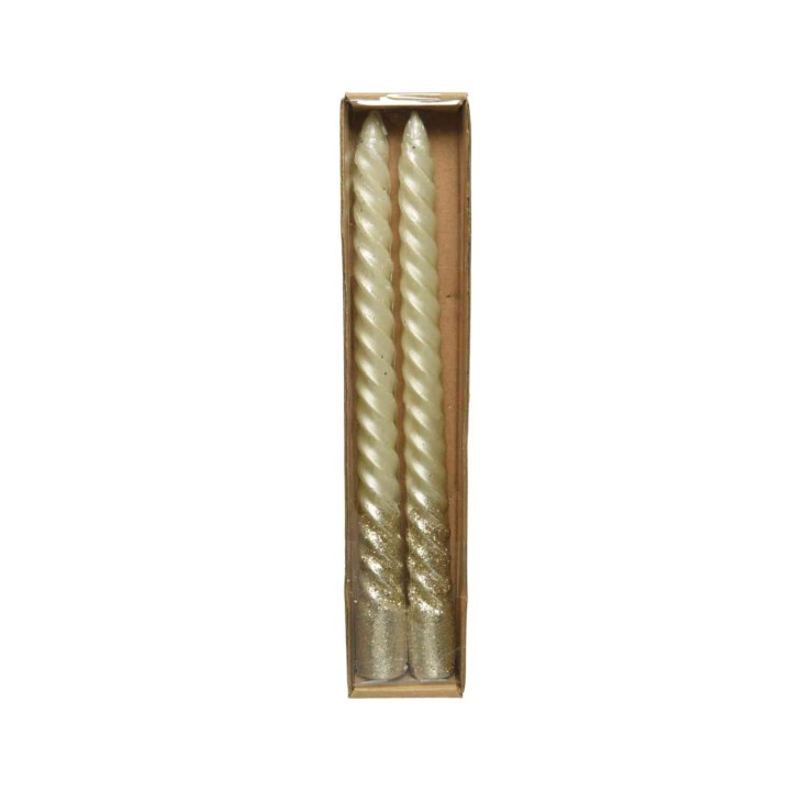 Two twisted, glittery gold candles in a simple cardboard box.
