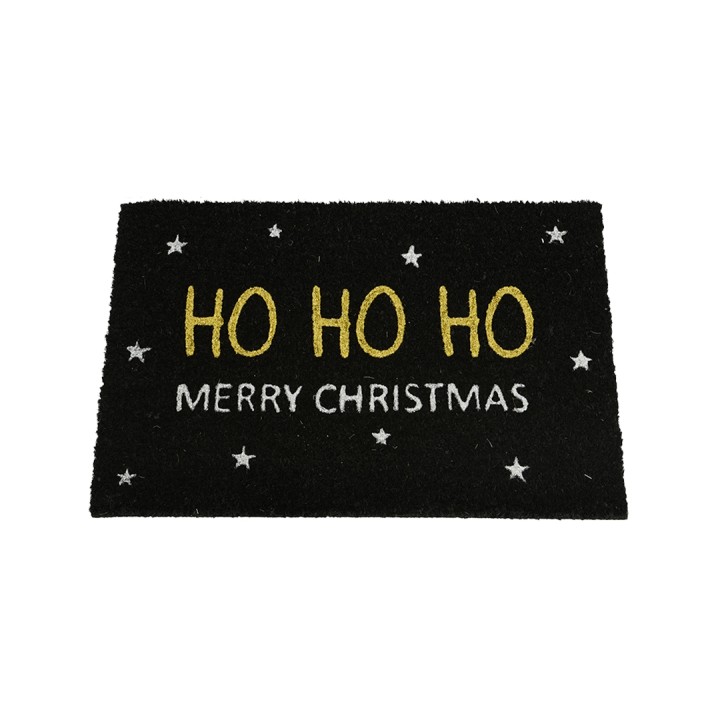 A black doormat with "HO HO HO" in gold and "MERRY CHRISTMAS" in white, surrounded by stars.