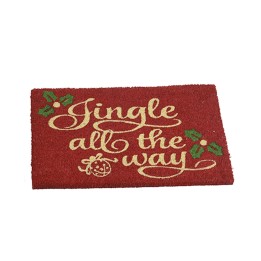 A festive red doormat with golden cursive text and green holly accents.