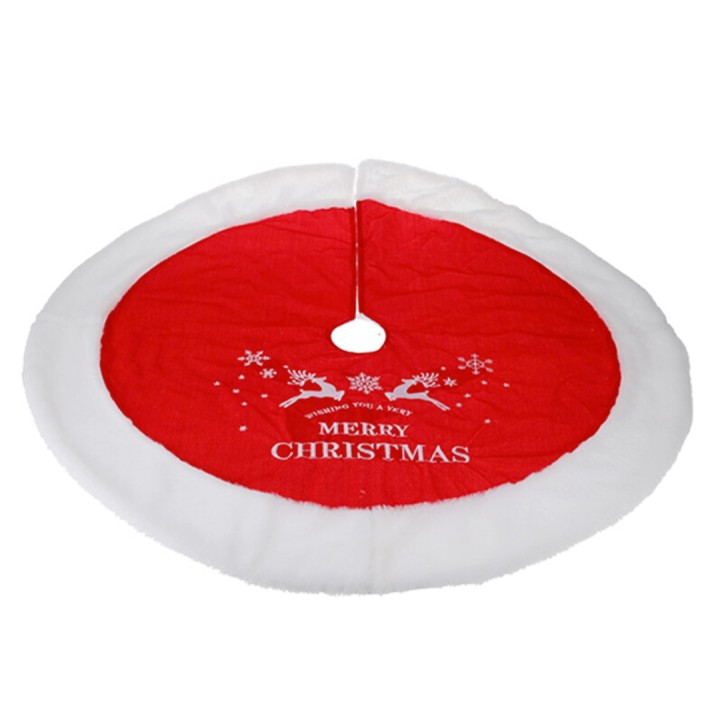 A round red Christmas tree skirt with white fur trim and festive reindeer design.