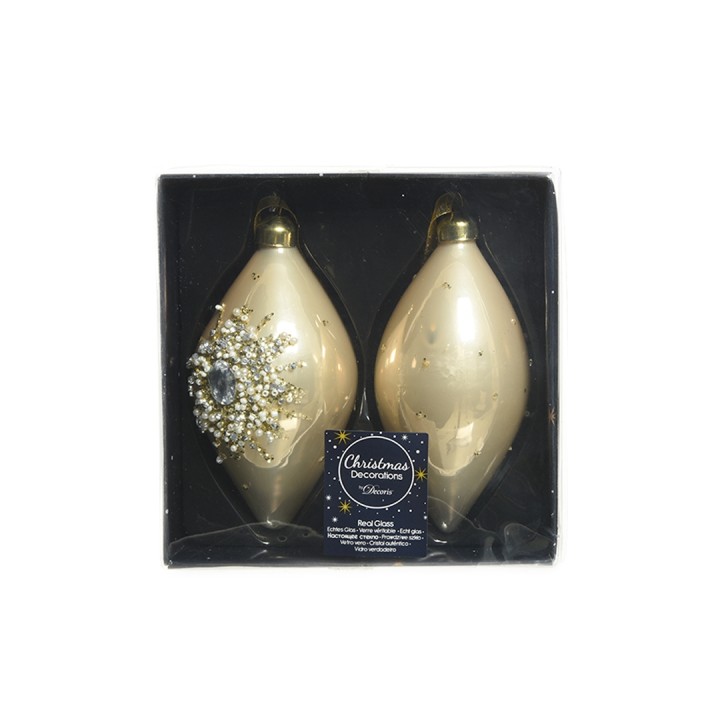 Two elegant gold Christmas ornaments, one adorned with a sparkling icy design, in a gift box.