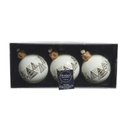 Three white Christmas ornaments with black geometric patterns and wooden caps in a box.