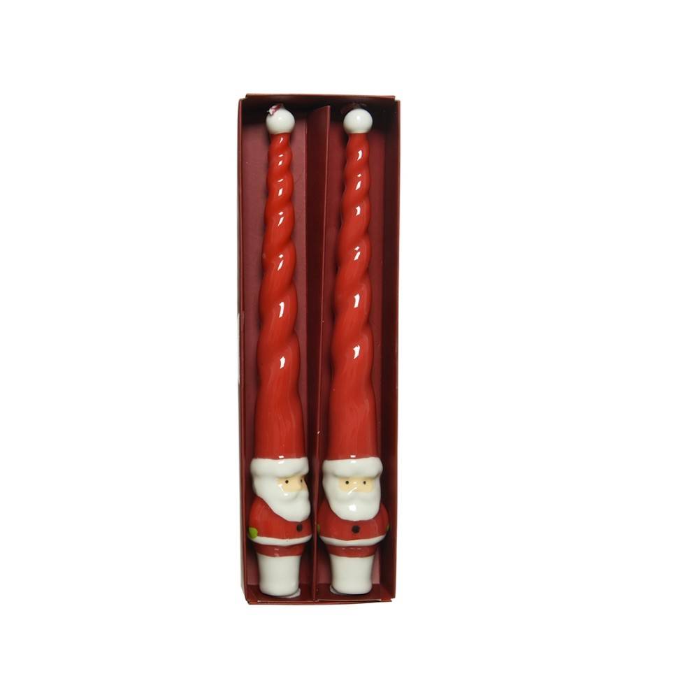 Long wax candles with Santa Claus motifs