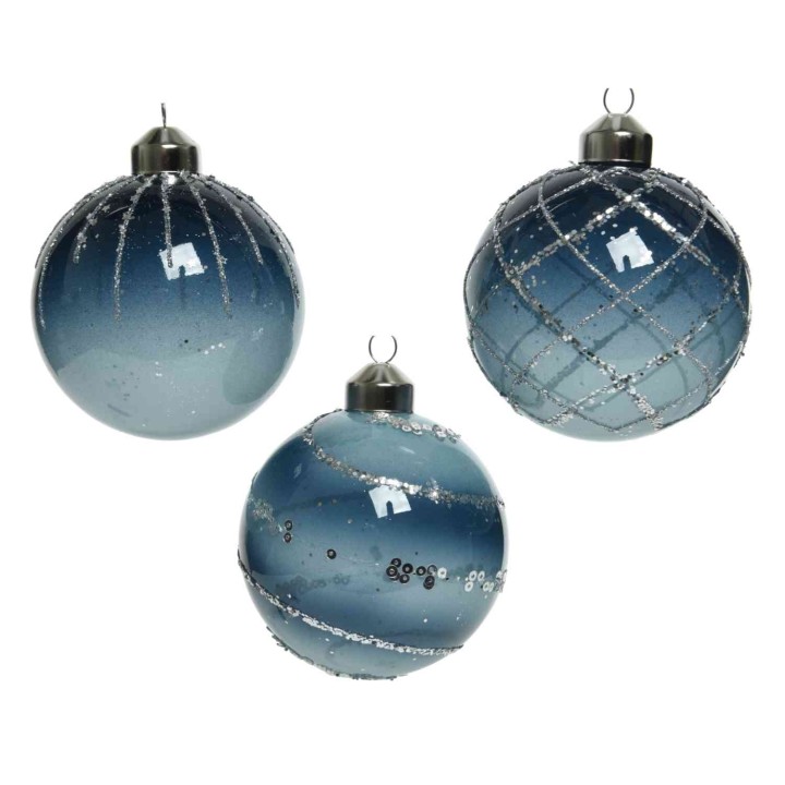 Three glass ornaments in shades of blue, adorned with silver patterns and glitter.