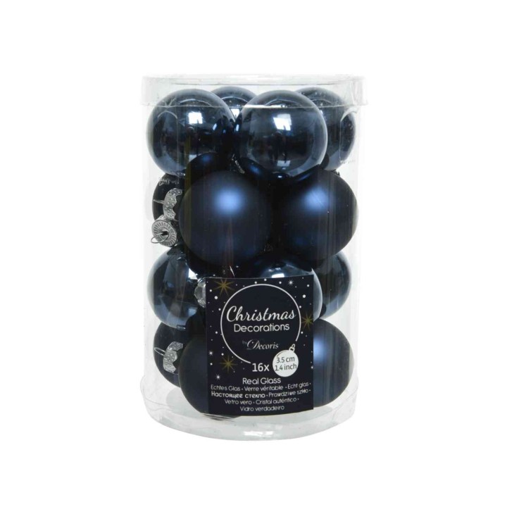 A clear container filled with shiny navy blue Christmas baubles, featuring various finishes.