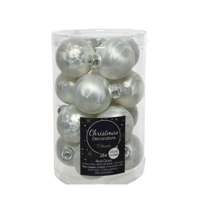 A clear container filled with shiny silver glass Christmas ornaments.