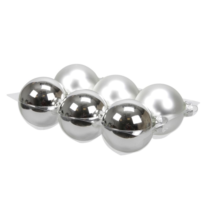 Zes glanzende bollen in zilver en parelmoer, elegant gerangschikt op een lichte ondergrond.