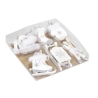 A set of white wooden ice skates and sleds, adorned with fluffy accents and snowflake designs. A set of white wooden ice skates and sleds, adorned with fluffy accents and snowflake designs.