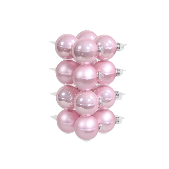 A stack of glossy pink ornaments, varying in shades and reflecting light beautifully.