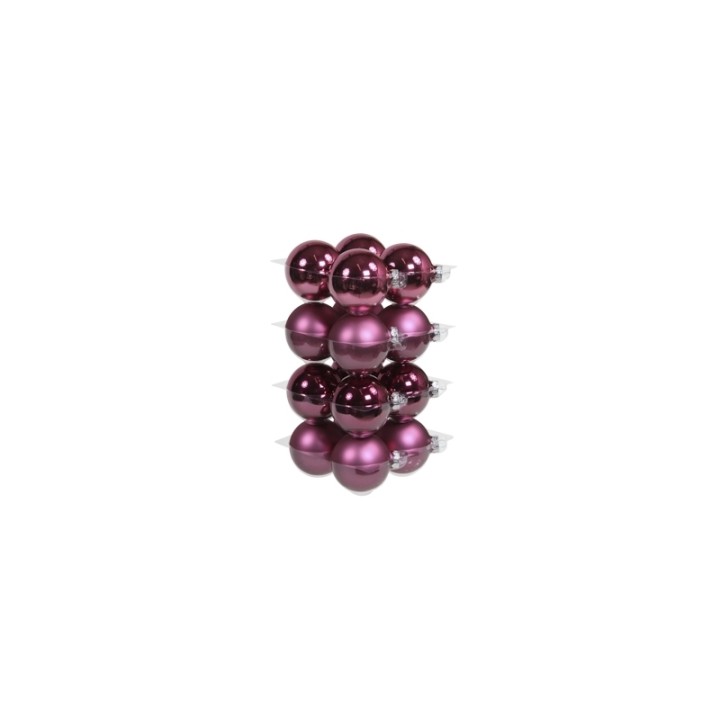 A stack of shiny, deep purple Christmas ornaments in various finishes.
