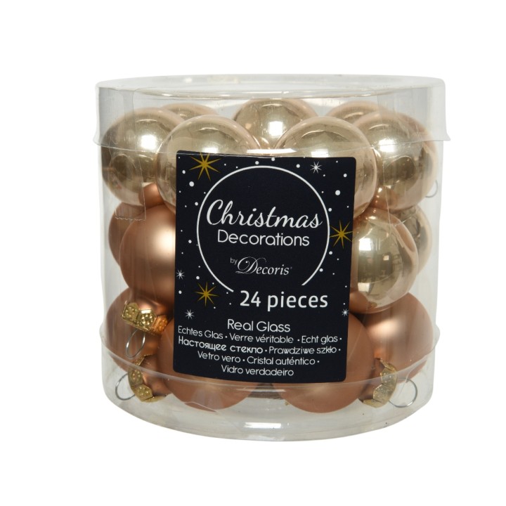 A clear container filled with shimmering gold and copper Christmas ornaments.