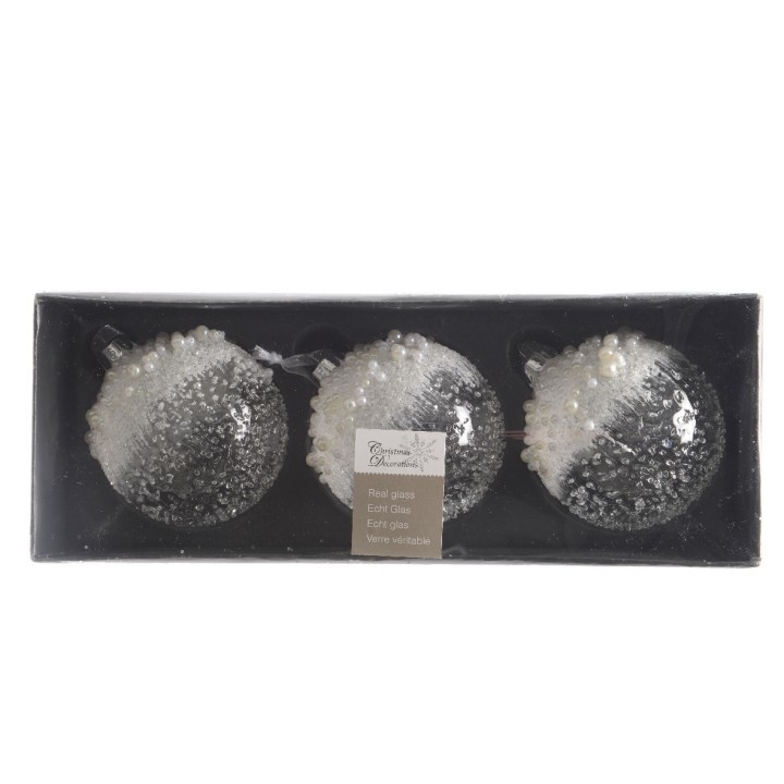 Drie glazen kerstballen met een glinsterende, witte afwerking in een zwarte doos.