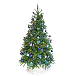 A lush green Christmas tree adorned with blue and teal ornaments, shimmering lights, and ribbons.