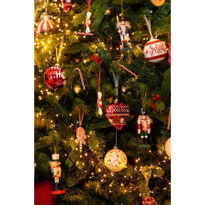 A festive Christmas tree adorned with colorful ornaments and twinkling lights.