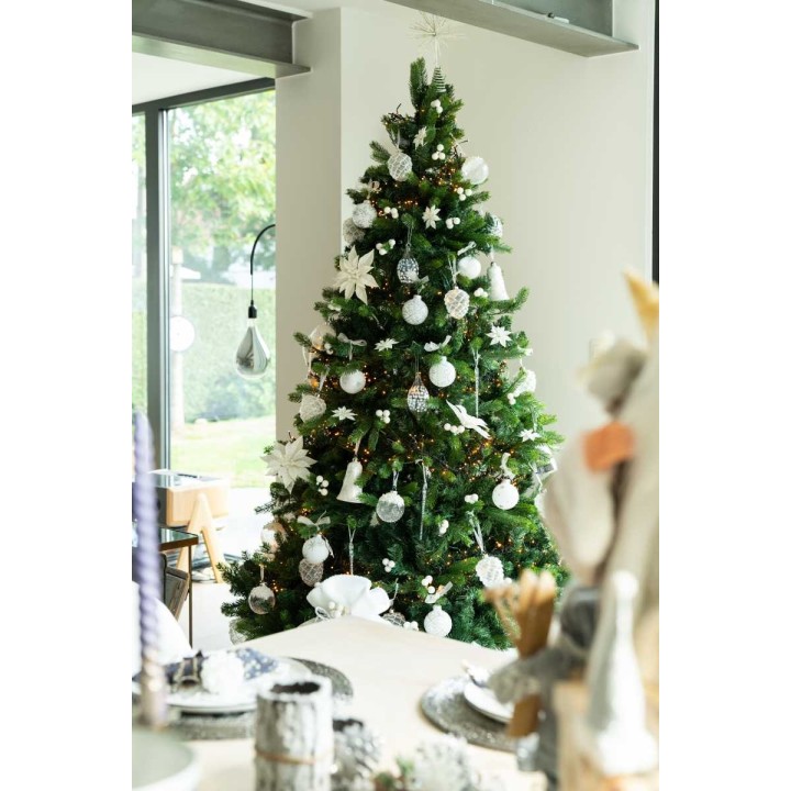 A beautifully decorated Christmas tree adorned with white ornaments and silver accents.